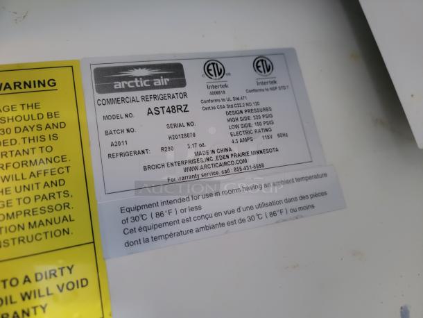 Arctic Air Commercial Refrigerator label, model AST48RZ, refrigerant R290, serial H20128070, 115V, 4.3 amps.