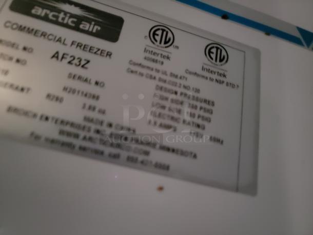 Arctic Air Commercial Freezer AF23Z label, serial no. H20114650, 115V, 3.85 oz refrigerant, indicating specifications and standards.