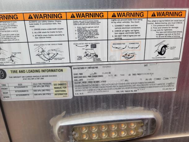 Warning label and manufacturer information on a Texino trailer. GVWR: 9525 lbs, date: 12/2023, tire specs included.