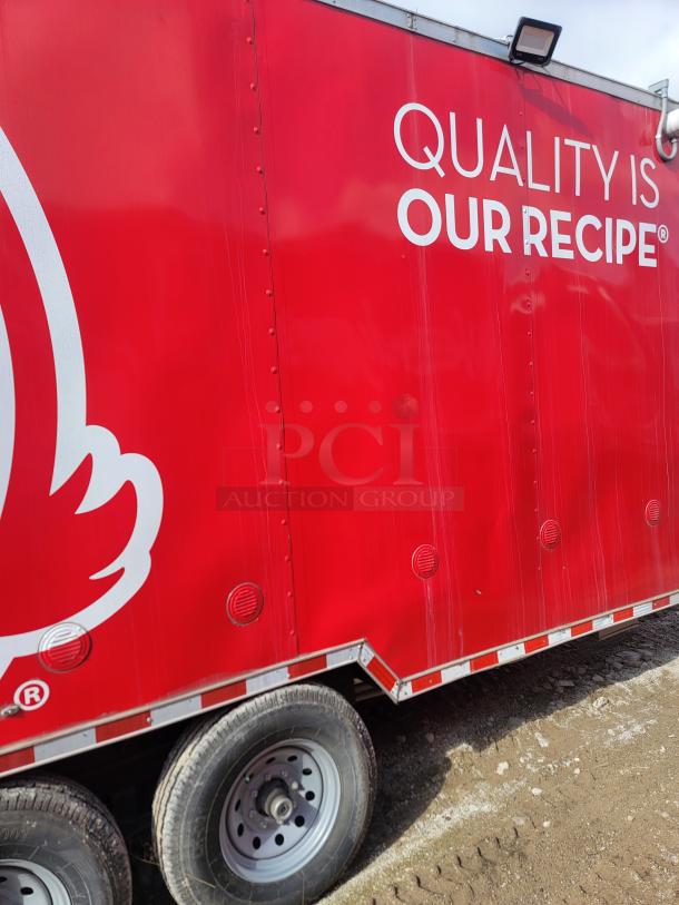 Red food trailer featuring the text "Quality is Our Recipe" and a partial logo. Dual axle wheels, good condition, light scuffs.