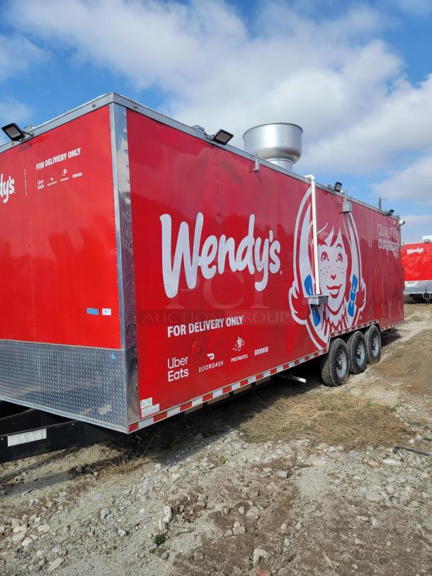 Mobile food trailer with Wendy's branding, vibrant red exterior, marked "For Delivery Only" featuring Uber Eats, DoorDash logos.