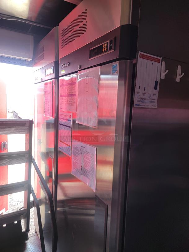 Commercial stainless steel refrigerator with digital display, model True T-49. Features include document holders and data sheets.