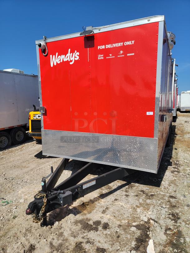 Red Wendy's delivery trailer with logos for Uber Eats, DoorDash, Postmates, Grubhub. Diamond plate panel, tow hitch visible.