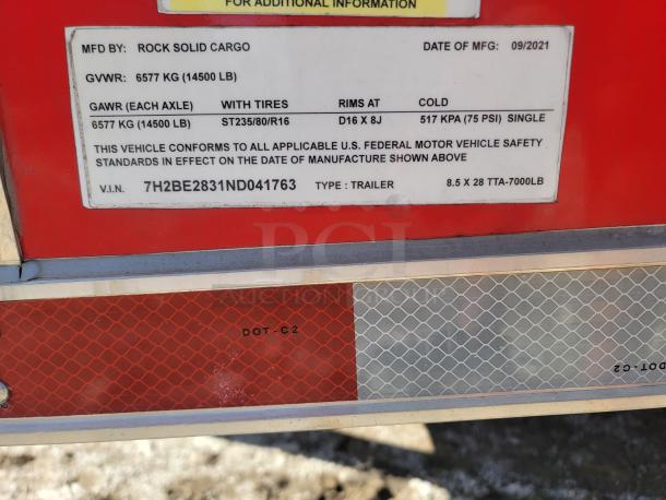 Red Rock Solid Cargo trailer label showing specs: GVWR 6577 kg, GAWR 6577 kg, rim size D16 X 8J, VIN 7H2BE2831ND041763.