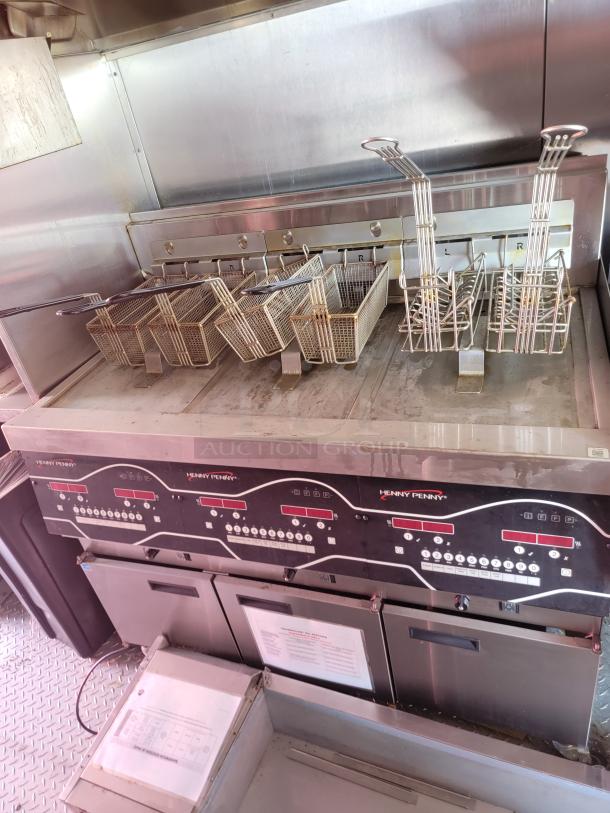 Henny Penny commercial deep fryer with multiple baskets, stainless steel, excellent condition, control panel with digital display.