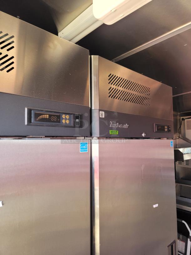 Stainless steel Turbo Air refrigerator, digital temperature display, energy certification tag, excellent condition.