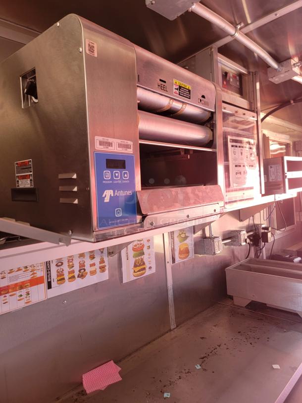 Antunes commercial toaster in stainless steel, featuring dual rollers labeled "HEEL" and "CROWN." Appears in used condition.