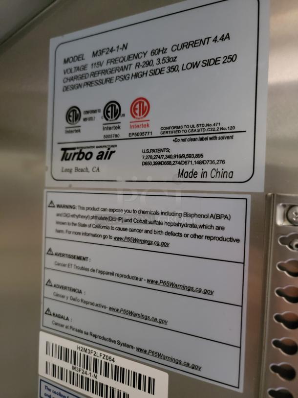 Label on Turbo Air model M3F24-1-N with specs: 115V, 60Hz, 4.4A. Warnings about chemical exposures and safety certifications.