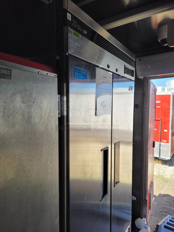 Turbo Air commercial refrigerator, stainless steel, double-door, good condition, visible brand label, premium quality sticker.