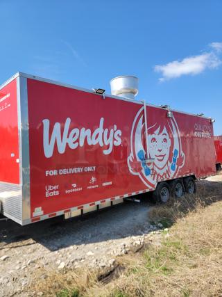 Red Wendy's delivery trailer with logo, text indicating use for delivery only. Services include Uber Eats, DoorDash, Postmates.