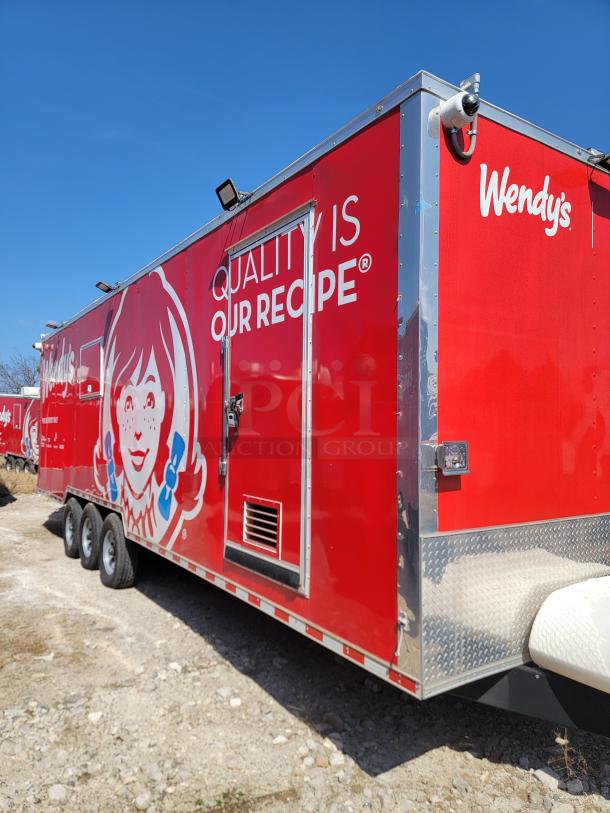 Red Wendy's food trailer, featuring brand logos and slogan "Quality is Our Recipe." Triple-axle, shiny condition.