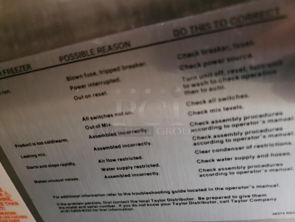 Instructional label with troubleshooting reasons and corrections for a Taylor machine. Lists common issues like power interruption and assembly errors.