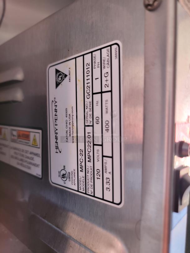 Henny Penny appliance label showing model MPC-22, serial GC2111012, 120 volts, 400 watts, 3.33 amps.