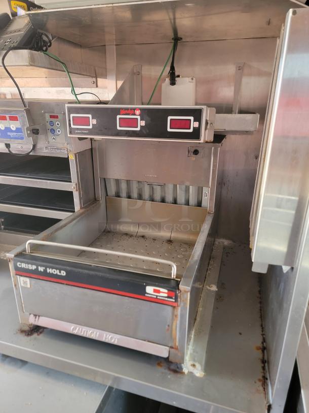 Crisp N' Hold unit, stainless steel, digital controls, visible rust, "Wendy's" branding, "Caution Hot" marking on front.