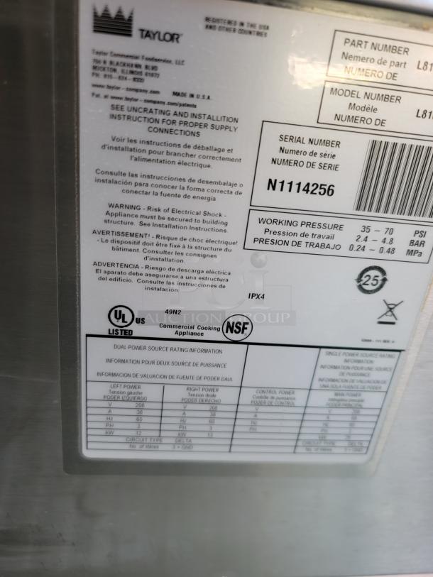 Label on Taylor commercial cooking appliance, serial N1114256. Features power ratings, safety warnings, UL and NSF certifications.