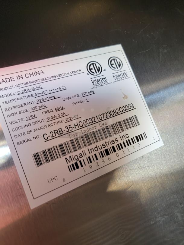 Label on cooler, Migali Industries Inc., Model C-2RB-35-HC. Shows ETL certifications, voltage, refrigerant, and manufacturing info.