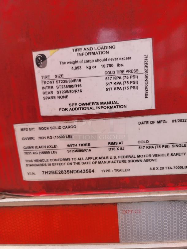 Red Rock Solid Cargo trailer label showing tire and loading info, GVWR 7031 kg, GAWR 7031 kg, VIN 7H2BE2835ND043564.