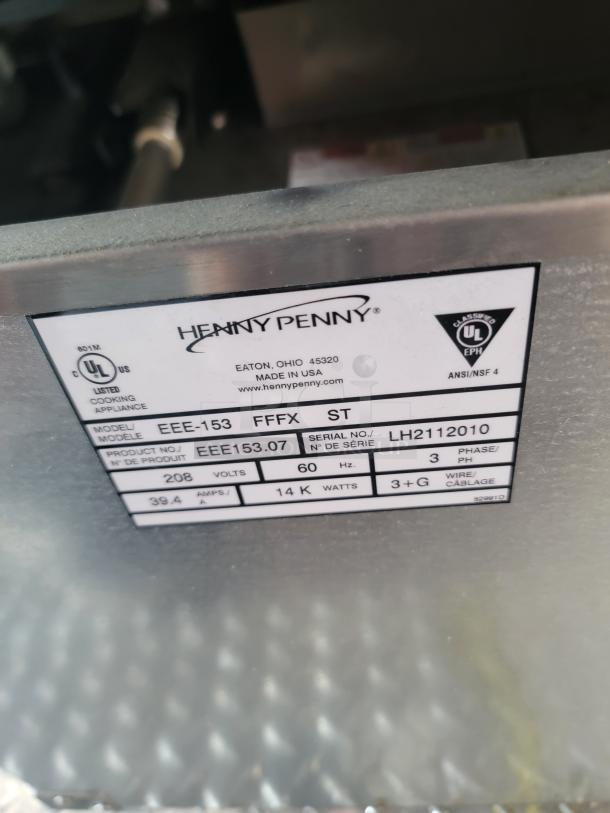 Henny Penny EEE-153 model appliance label, showing model, serial number, voltage, and wattage details for auction.