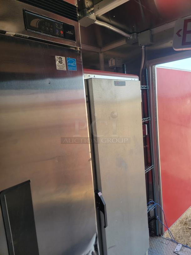 Stainless steel commercial refrigerator, showing control panel, Energy Star label; used condition with visible wear.