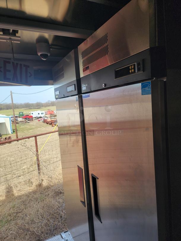 Stainless steel commercial refrigerators, Energy Star certified, with digital controls and ventilation grilles, shown in outdoor setting.