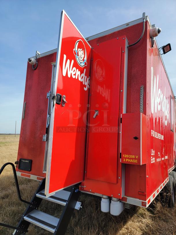 Wendy's branded food truck with red exterior, open door, stairs, and delivery service decals. Marking reads "120/208 V 3 Phase."