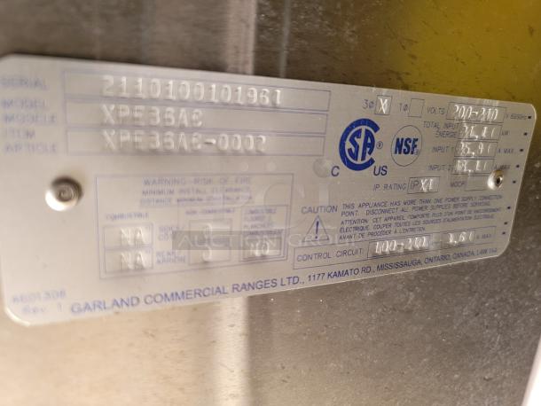 Garland Commercial Ranges model XPE36AC metal label showing serial number, voltage, and certification marks.