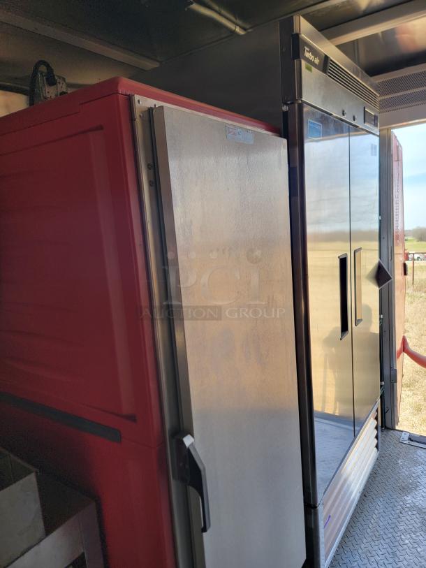 Commercial refrigerators, including a Turbo Air model, with stainless steel doors and visible brand markings, in good condition.