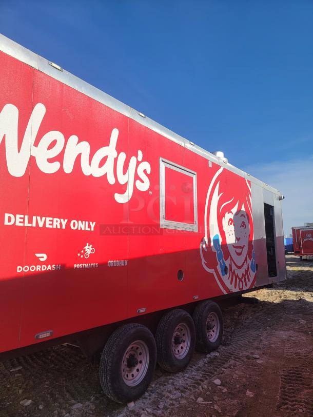 Red Wendy's delivery trailer with logos for DoorDash, Postmates, and Grubhub. No VIN visible. Condition appears good.