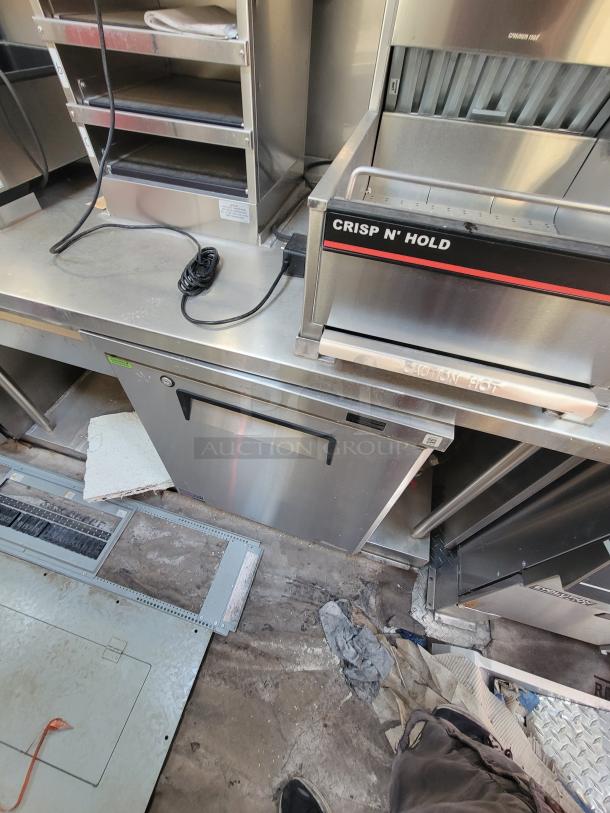 Commercial stainless steel kitchen equipment featuring a Crisp N' Hold hot holding unit. Good condition with visible wear.