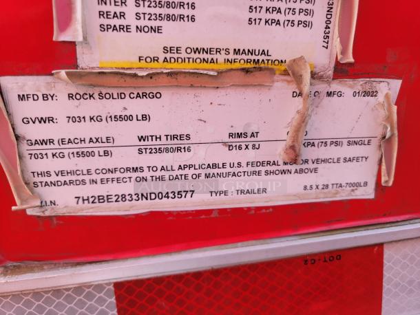 Rock Solid Cargo trailer label showing GVWR 7031 kg, GAWR 7031 kg, with tire size ST235/80/R16. VIN: 7H2BE2833ND043577.