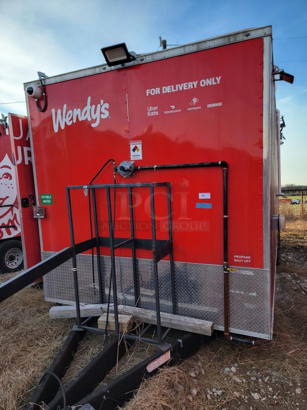 Red Wendy's delivery trailer with brand logos, labeled "For Delivery Only" and "Propane Shut Off." Features diamond plate trim.