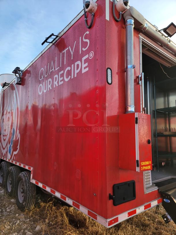 Red food truck with "Quality Is Our Recipe" text, equipped with external cameras, 120/208 V 3 phase power label. Good condition.