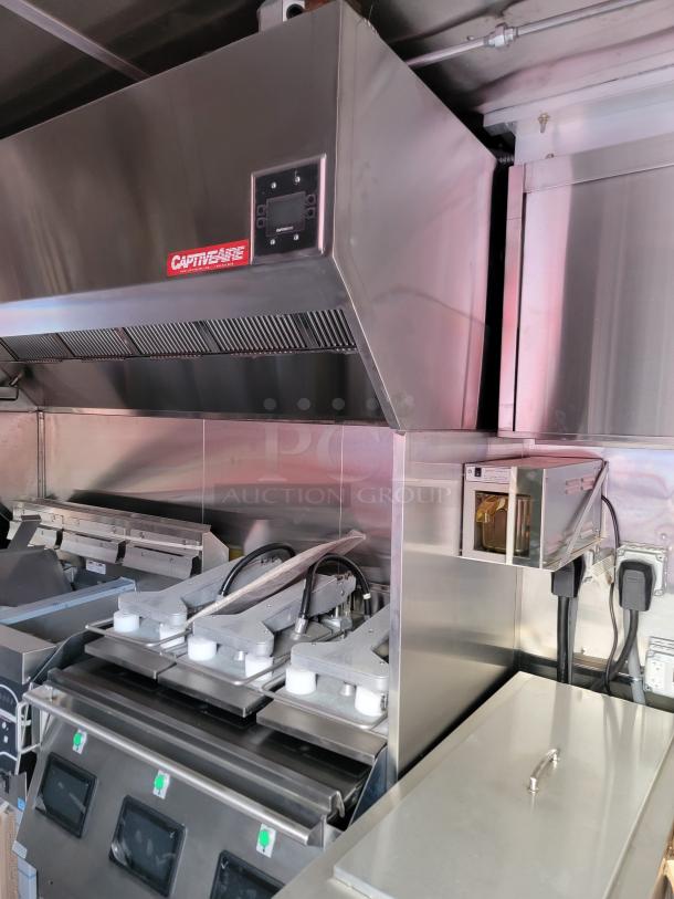 Stainless steel CaptiveAire commercial kitchen vent hood, with visible control panel, in excellent condition.