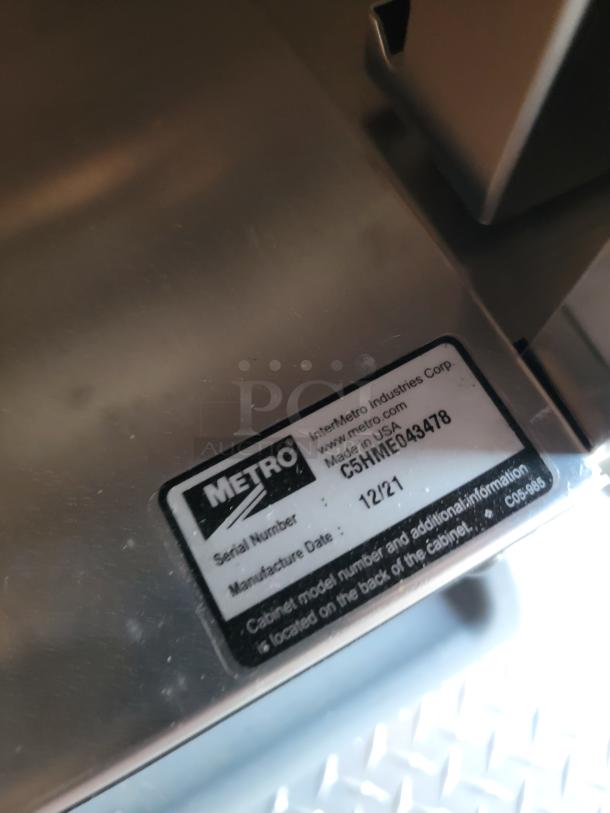 Metal equipment with Metro label showing serial number C5HME043478 and manufacture date 12/21. Made in USA.