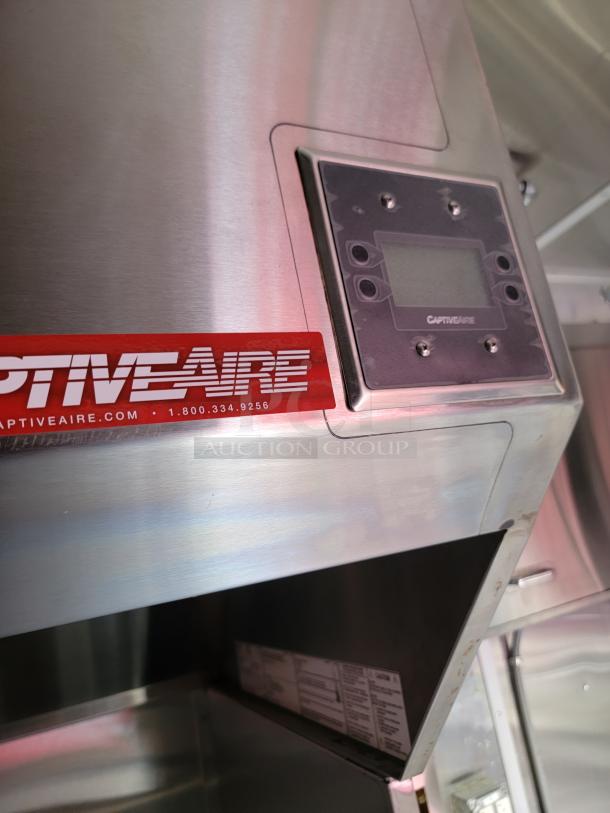 CaptiveAire commercial kitchen hood in stainless steel, featuring a digital control panel. Brand logo and contact info visible.