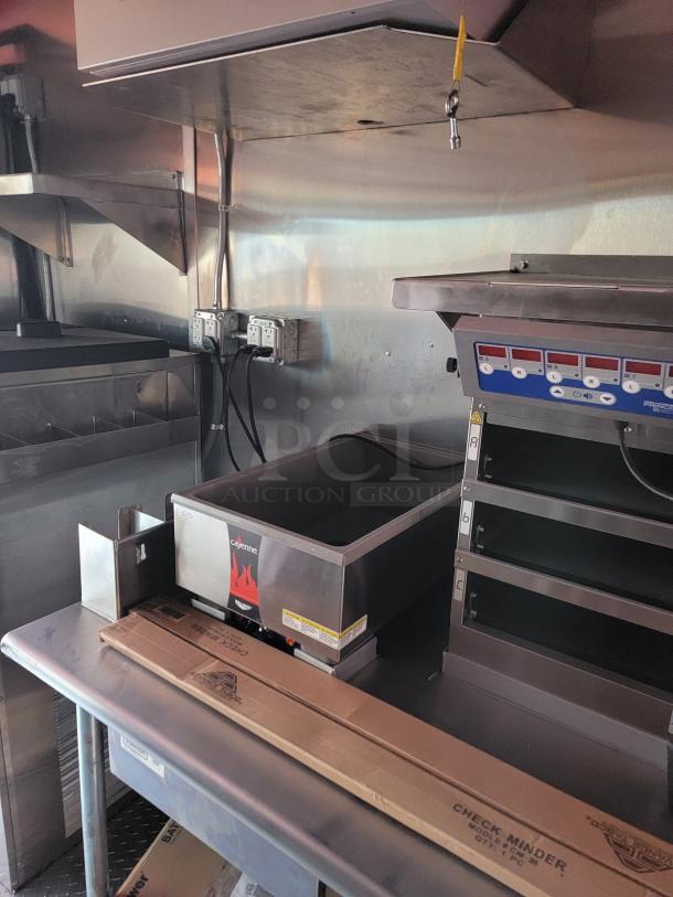 Commercial countertop food warmer, Cayenne brand, stainless steel, features digital controls, in good condition, labels intact.