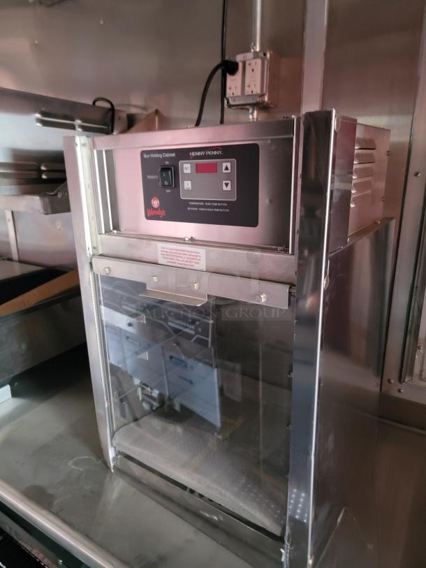 Henny Penny bun holding cabinet featuring Wendy's branding, with digital controls; in good condition.