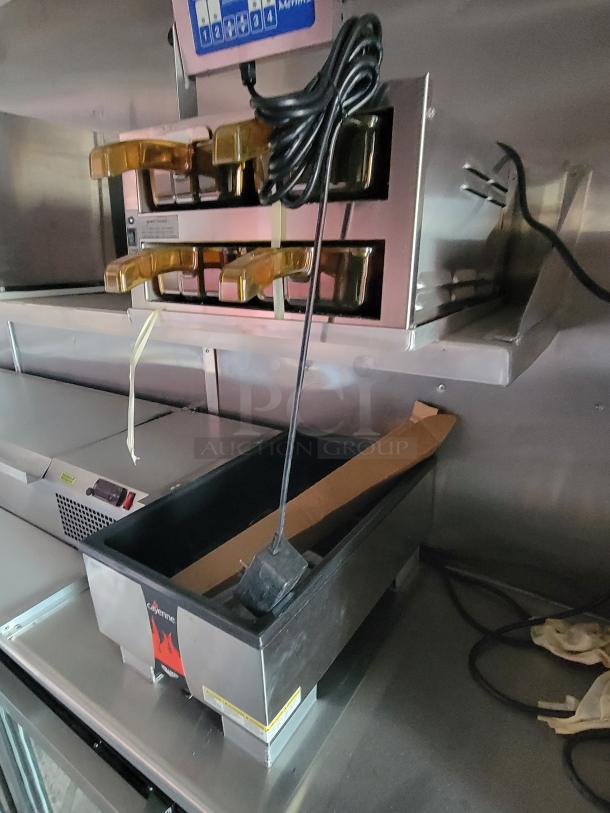 Cayenne food warmer in stainless steel, featuring multiple compartments, power cord, minimal wear, ideal for catering use.
