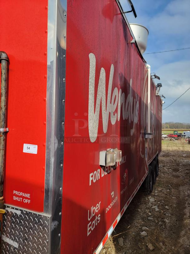 Red Wendy's food trailer for delivery; features service logos. Marked "Propane Shut Off" with visible wear, used condition.