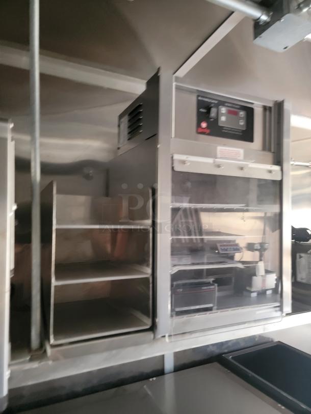 Commercial stainless steel shelving and warming unit with digital control panel, in excellent condition. Ideal for food service.