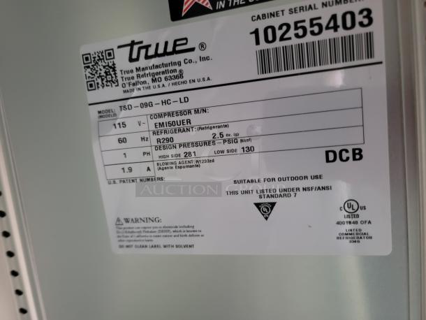 True refrigeration unit label featuring model TSD-09G-HC-LD. Details compressor model EMI50UER, refrigerant R290, design pressures, and suitability for outdoor use. Serial number 10255403.