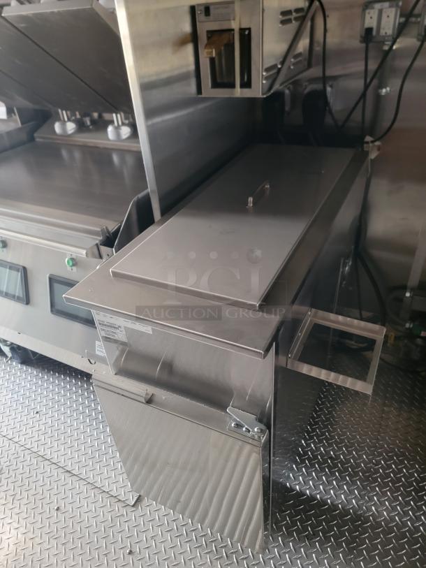 Stainless steel commercial fryer with lid, control panel, and visible power cords. In excellent condition.