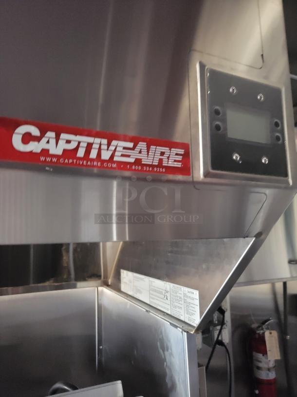 CaptiveAire commercial kitchen hood in stainless steel, with control panel. Excellent condition, visible brand and contact details.
