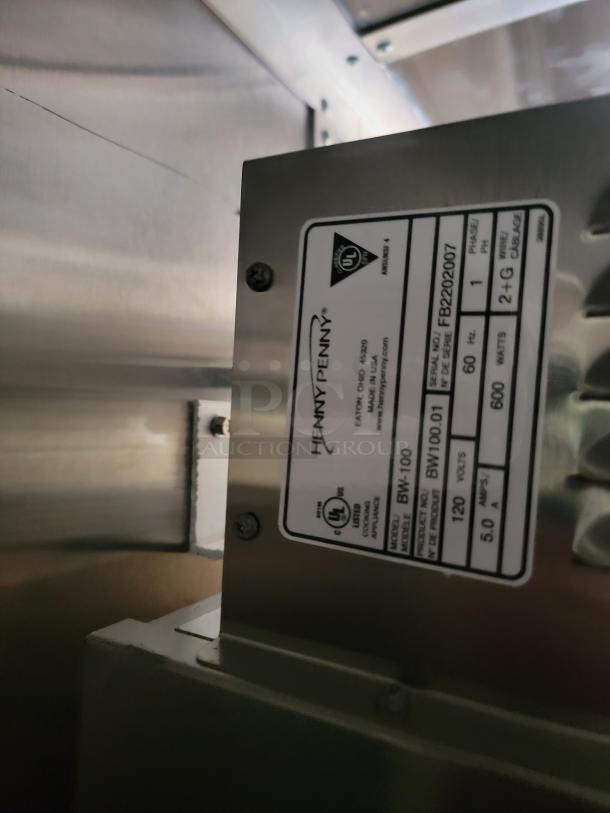 Henny Penny Model BW-100 label, serial FB2202007, 600 watts, UL certified, 120 volts, 5.0 amps, stainless steel.