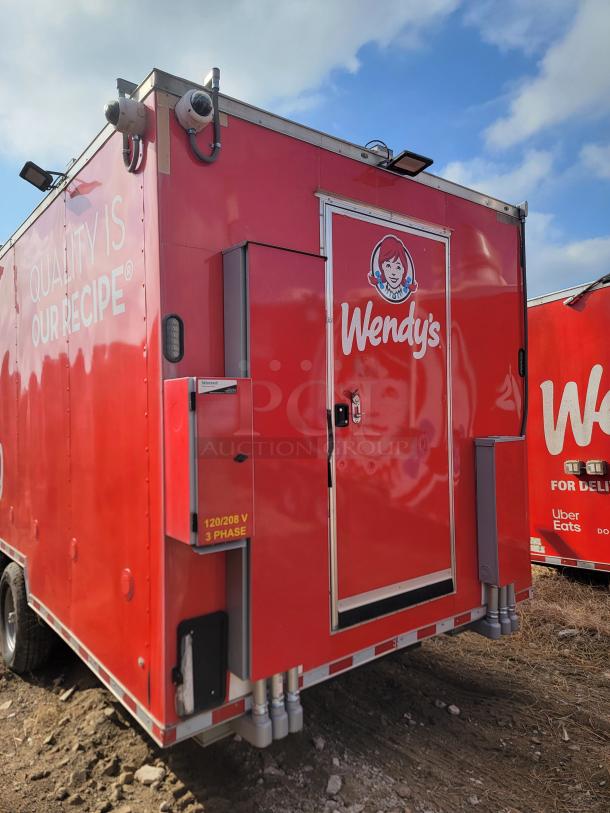 Red Wendy's food truck with security cameras, labeled "Quality is Our Recipe." Shows 120/208 V, 3-phase power marking.