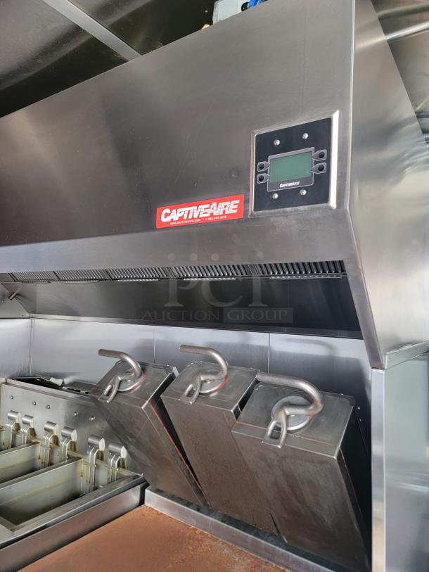 CaptiveAire commercial kitchen exhaust hood with digital control panel, stainless steel, clean condition, model tag visible.