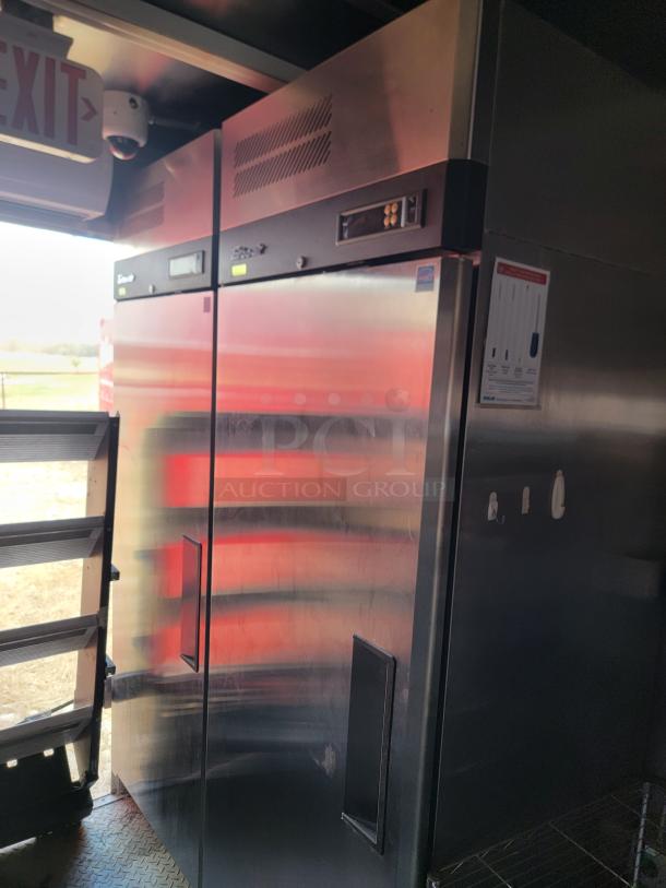 Stainless steel double-door commercial refrigerator with digital controls, sturdy handles, and minimal wear; ideal for food storage.