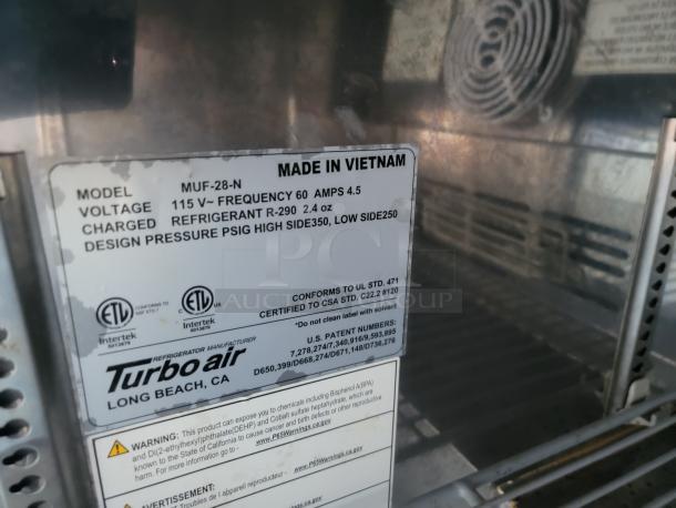 Turbo Air refrigerator model MUF-28-N label, details voltage, refrigerant, and design pressure. Made in Vietnam.
