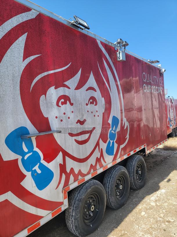 Mobile food trailer with Wendy's branding, featuring the logo and "Quality is Our Recipe" slogan. Visible wear on exterior.