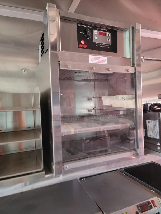 Henny Penny bun holding cabinet with Wendy's branding, digital controls, stainless steel, used condition.